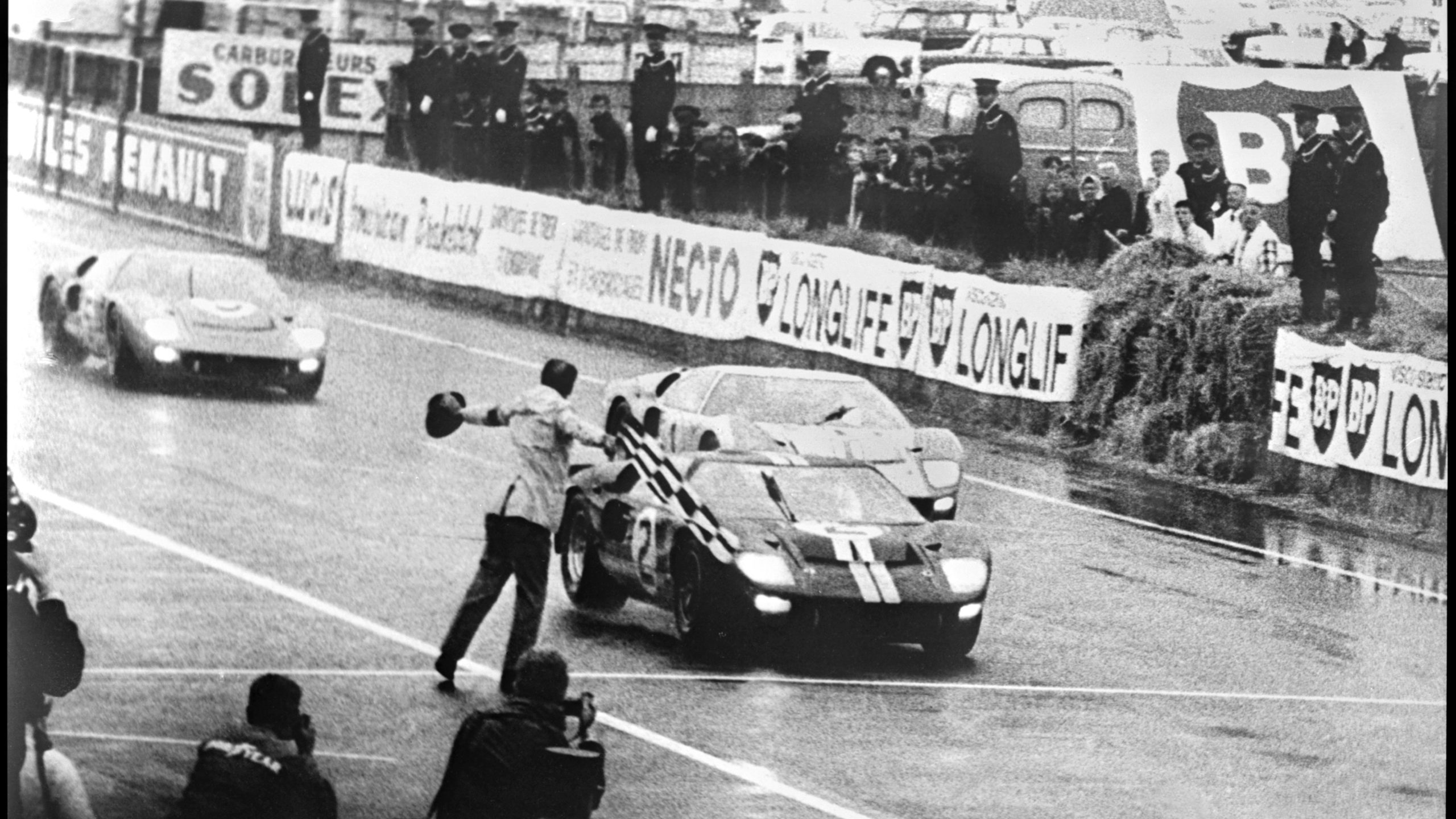 Trio of Ford GT40 Mk IIs cross finish line at Le Mans 1966